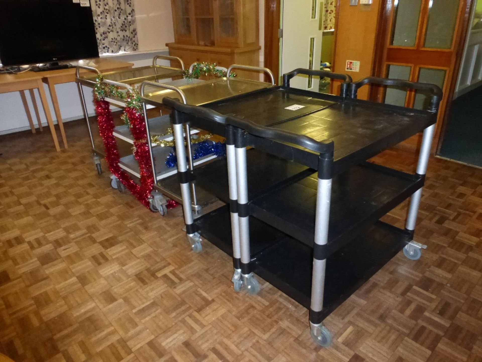 4 stainless steel three tier trolleys and 2 plastic three tier trolleys (located in room 36)