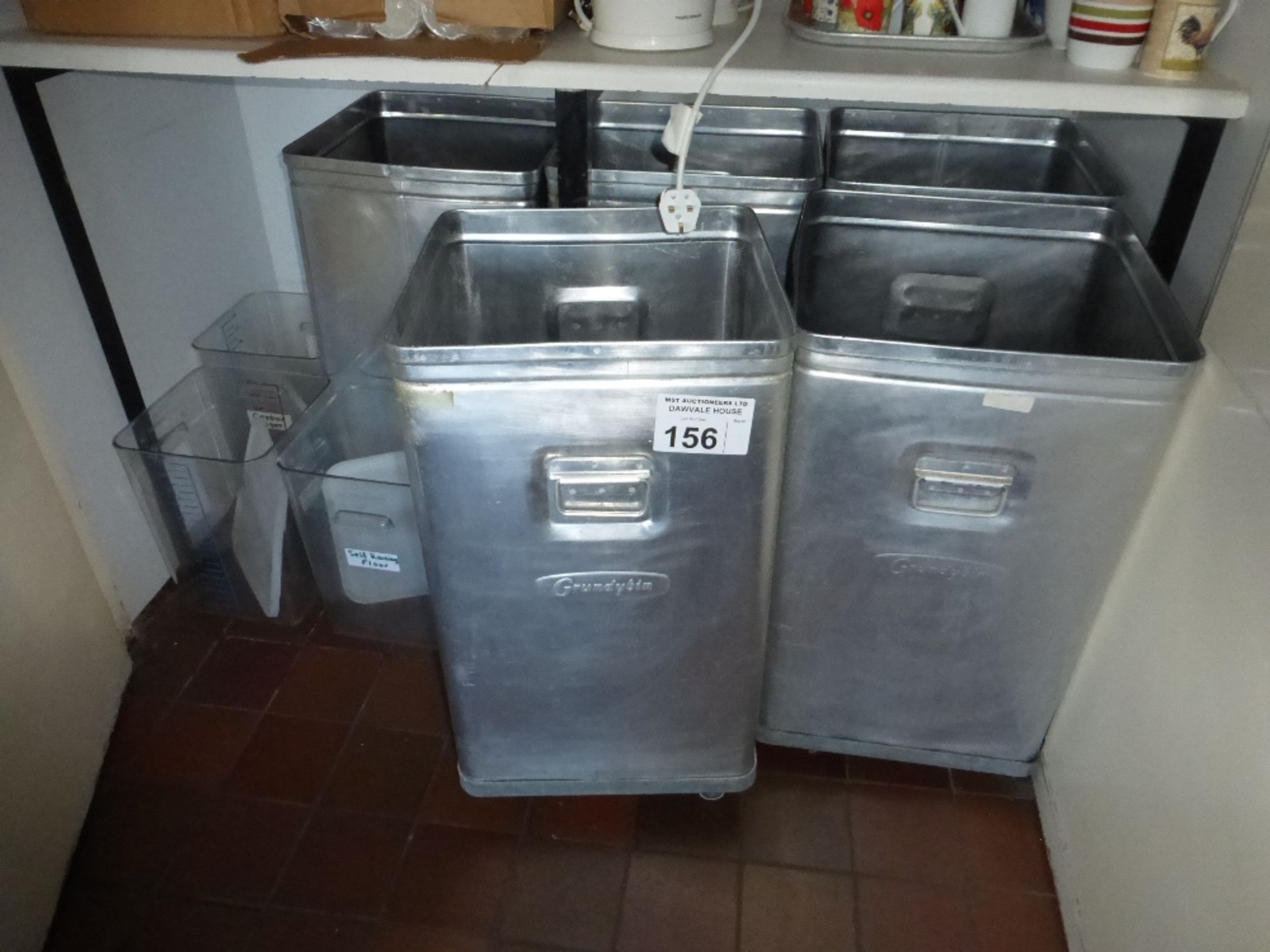 5 aluminium food bins on casters and three plastic bins (located in kitchen area)