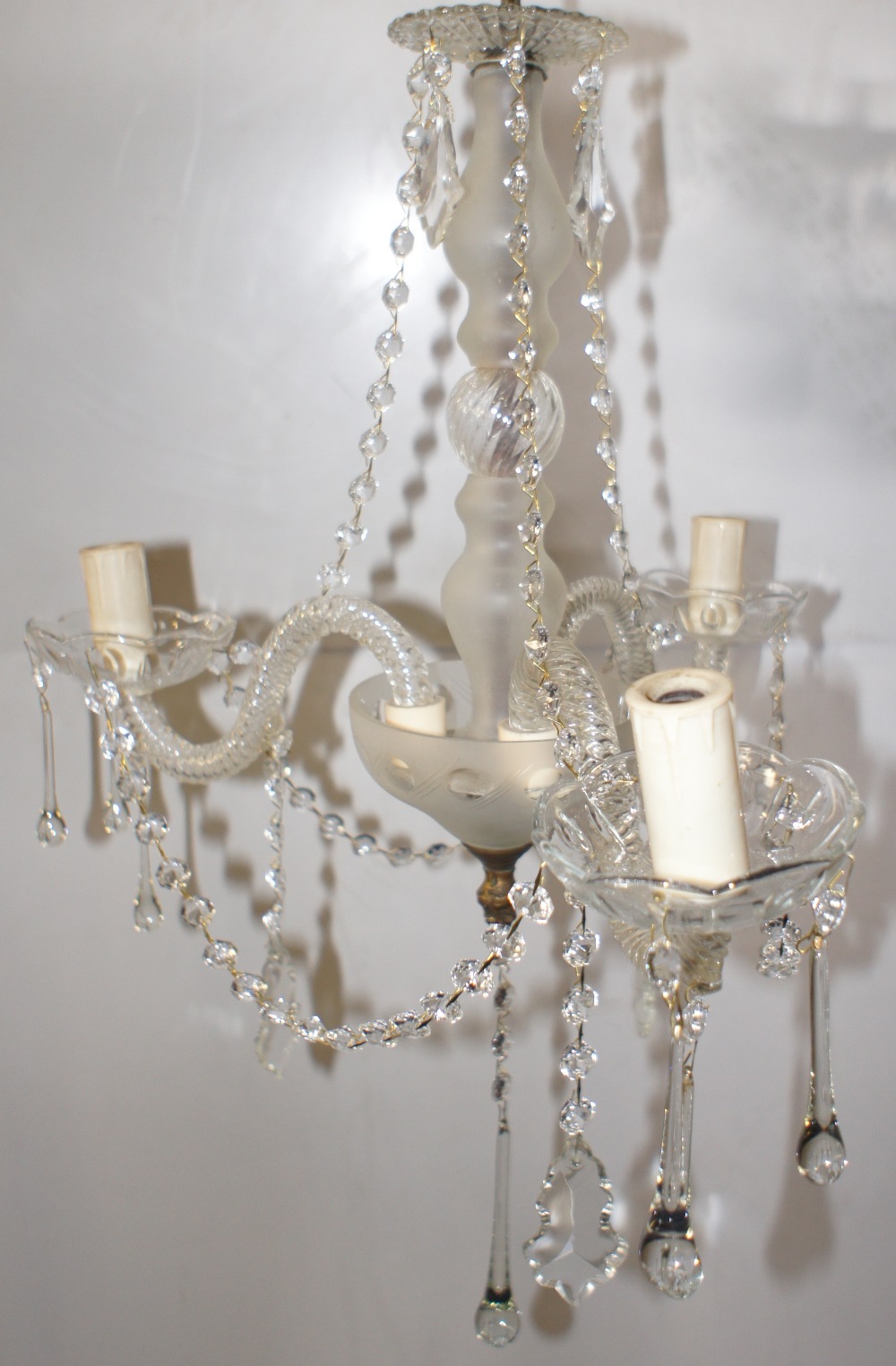 NV- an ornate three branch hanging light with cut glass droplets