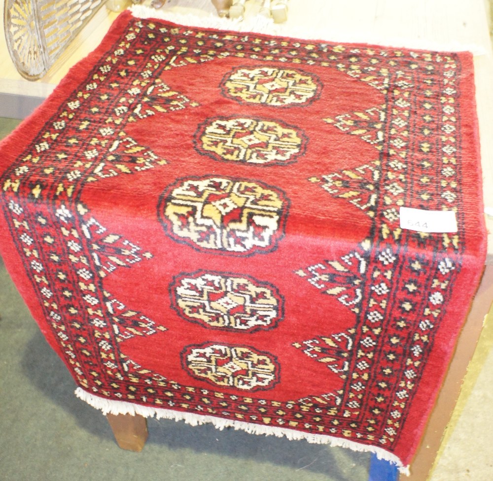 NV- a small red ground Bokhara design rug. Approx. 94 X 61cm