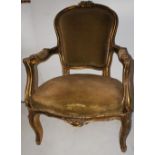 NV- A pair of gilt decorated French style armchairs with upholstered seats and backs