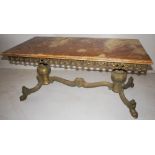 NV- A rectangular mottled marble top coffee table with an ornate brass base