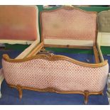 NV- A carved mahogany framed French style double bed with a pink upholstered head and foot