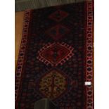 NV- a hand woven blue ground Persian runner. Approx. 310 X 100cm