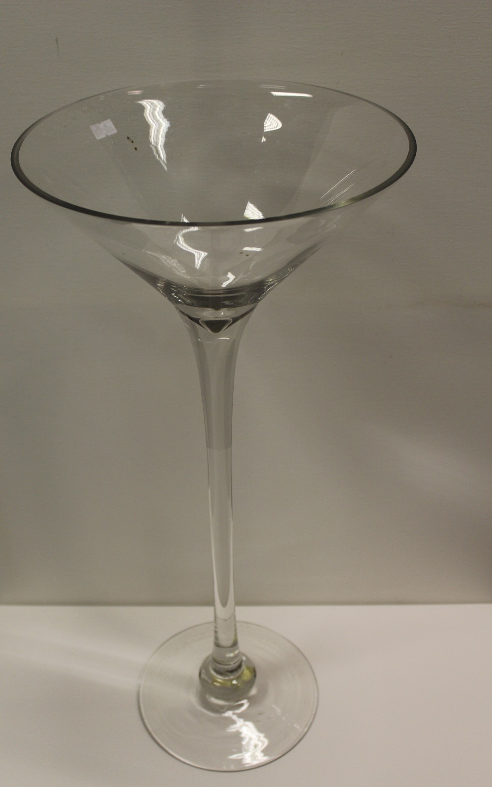 NV- a large and tall display type cocktail glass