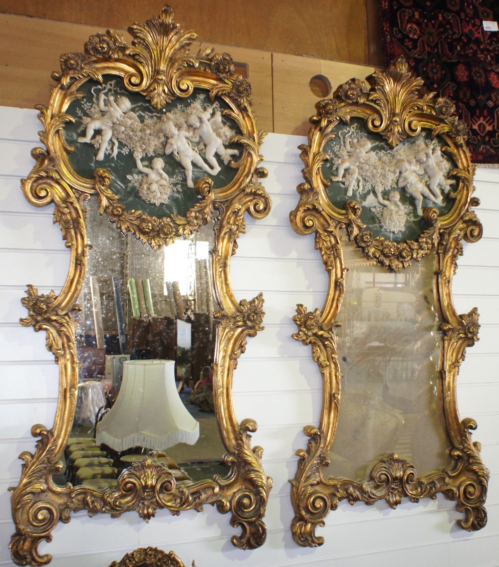 NV- A pair of large decorative wall mirrors with gilt work frames of foliate and scroll work