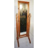 NV- A pine framed cheval mirror on a turned column support