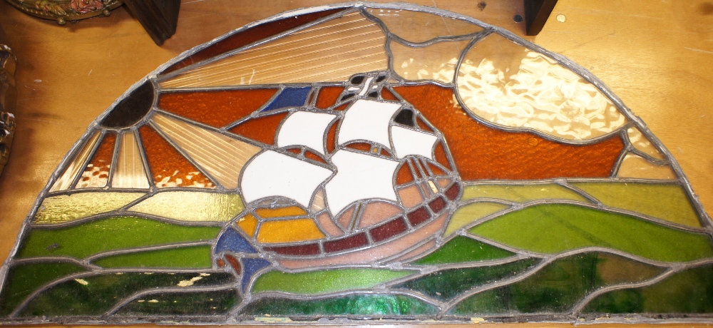 NV- a semicircular leaded stained glass panel of a ship