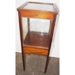 NV- A small mahogany display cabinet with a glass top and drawer under