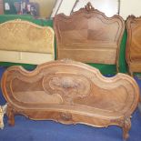 NV- A decorative carved mahogany French style double bed