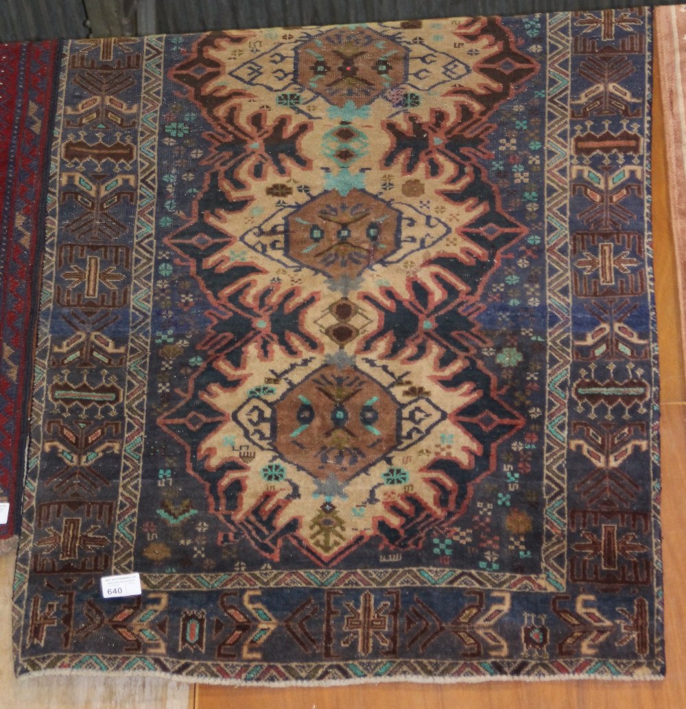 NV- a brown patterned Persian rug. Approx. 167 X 111cm - shows signs of wear and repair