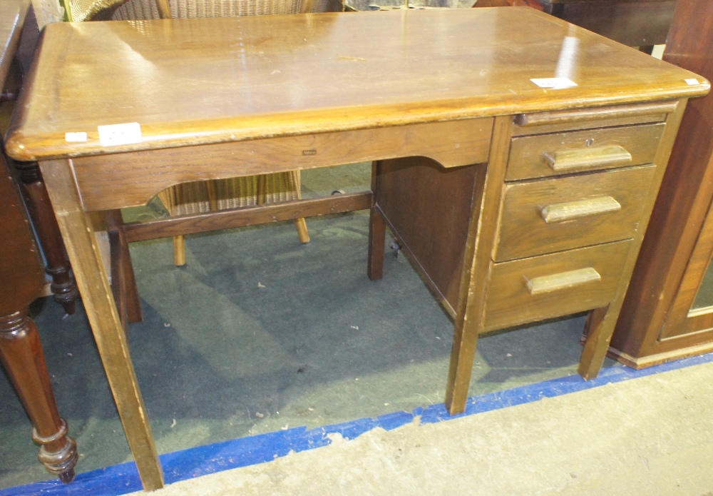 NV- a child’s dark wood single pedestal desk