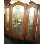 NV- A highly decorative carved mahogany French style armoire/wardrobe with a mirrored door and two