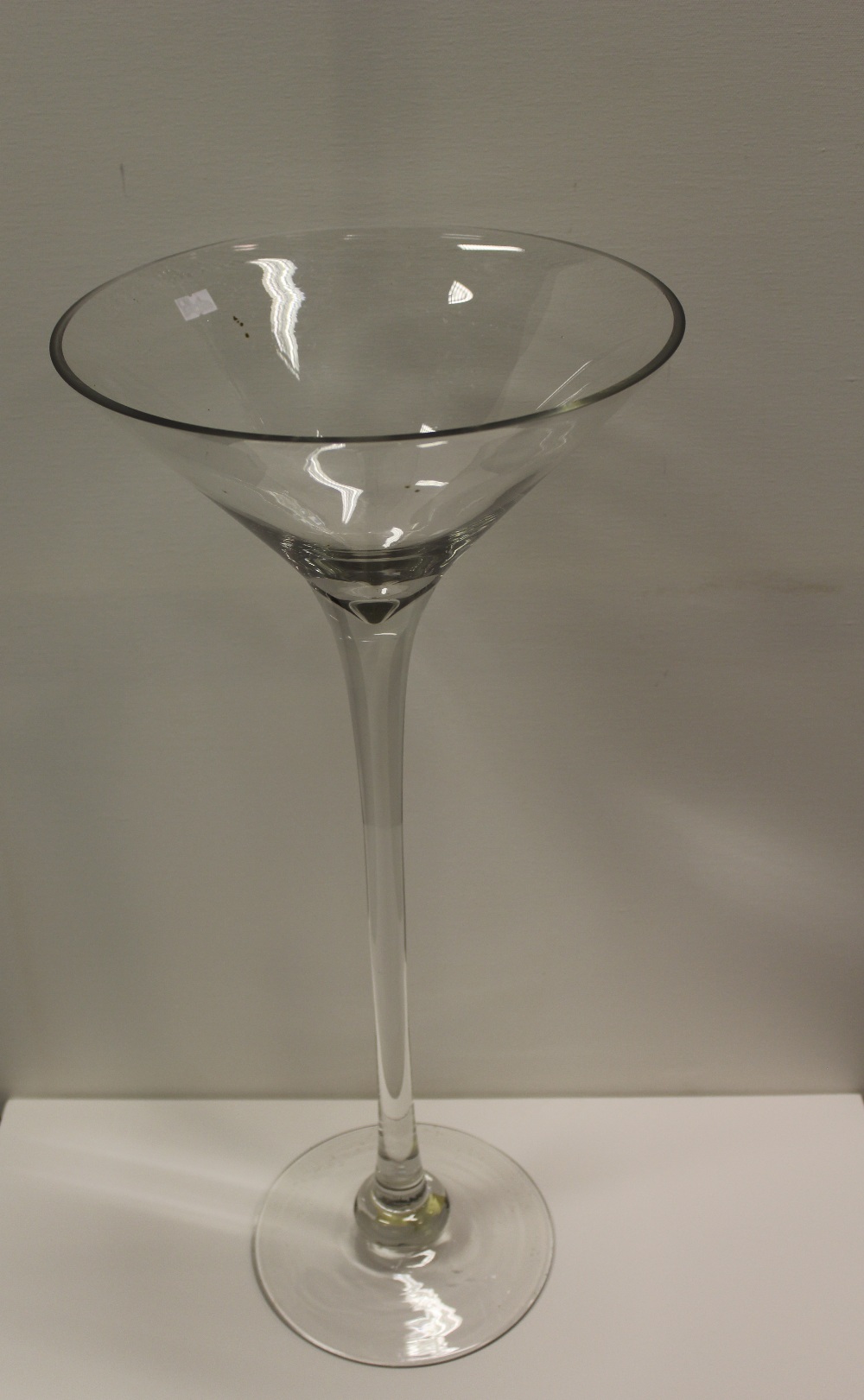 NV- a large and tall display type cocktail glass