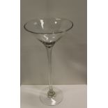 NV- a large and tall display type cocktail glass