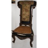 NV- A Victorian carved mahogany prayer chair with tapestry upholstery