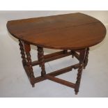 NV- A quality oak oval topped drop leaf gate legged table on twisted legs with one end drawer