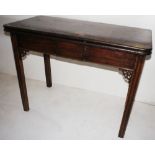 NV- A mahogany rectangular topped fold over tea table