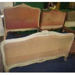 NV- A white painted French style double bed with a pink upholstered head and foot