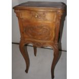 NV- A decorative French style bedside cabinet with a mottled marble top on cabriole legs