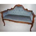 NV- A small two seater mahogany framed couch with blue buttoned upholstery