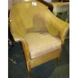 NV- a gilt painted Lloyd Loom conservatory chair