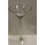 NV- a large and tall display type cocktail glass