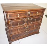 NV- an early oak two part chest of four drawers with brass pear drop handles