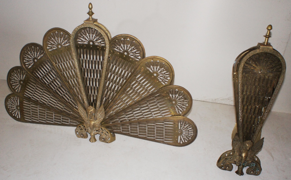 NV- 2 ornamental brass fire spark guards opening two a peacock fan display