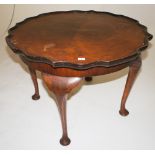 NV- a mahogany pie-crust circular coffee table on cabriole legs