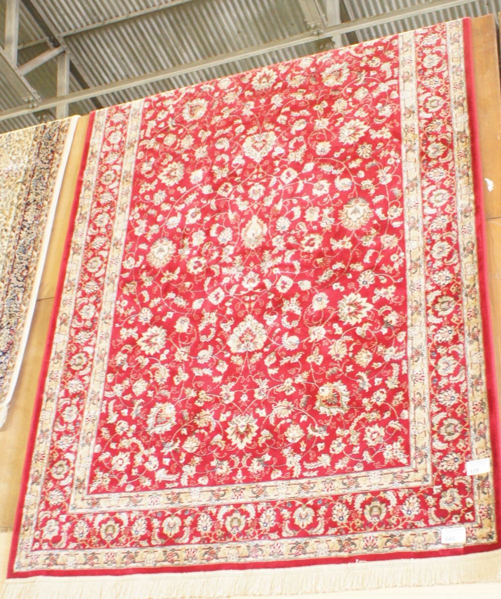 NV- a red ground carpet of all over design. Approx. 8’ X 5’