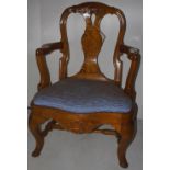 NV- A heavy walnut queen and style elbow chair with a lift out upholstered seat on cabriole legs
