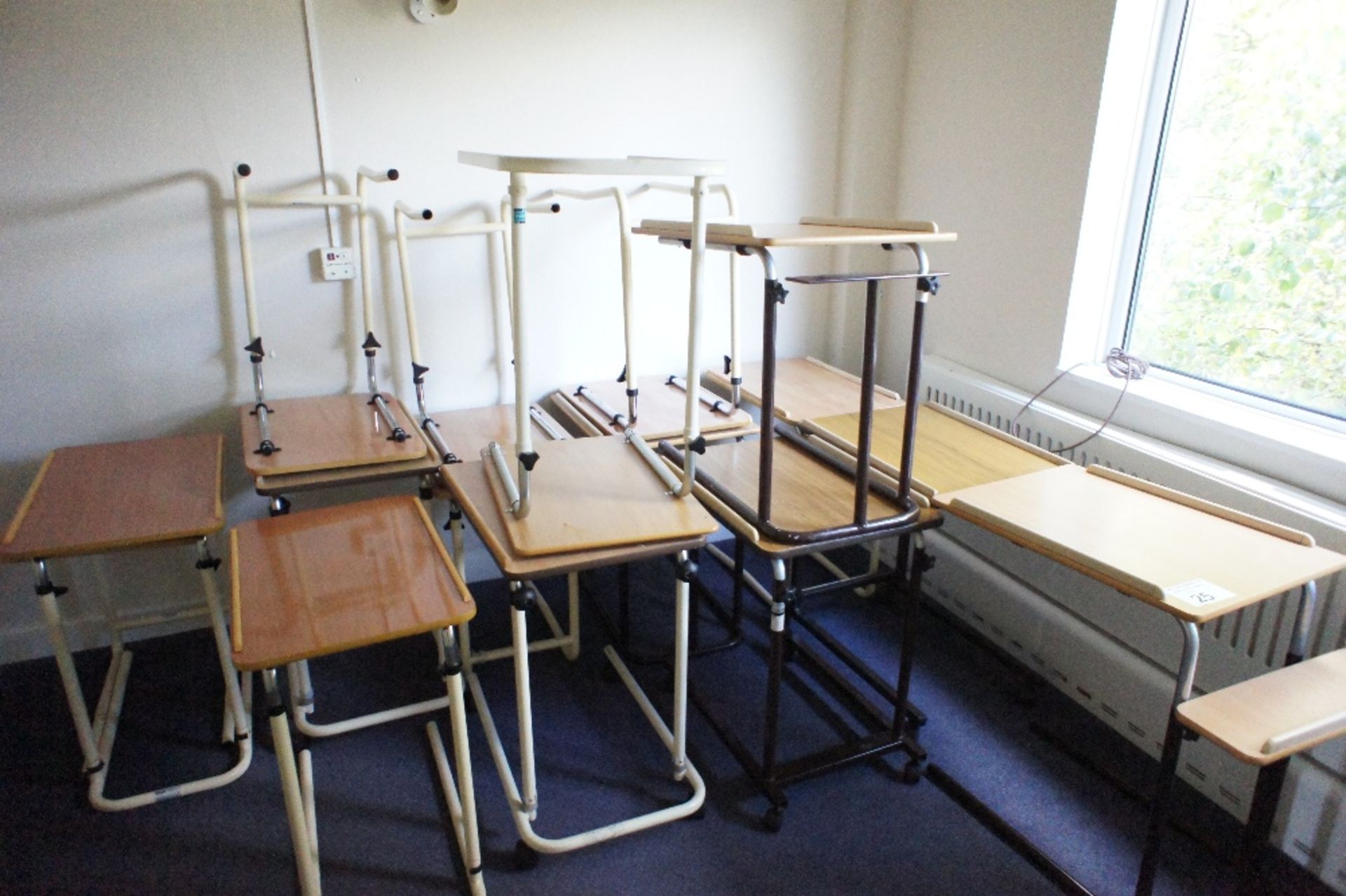 16 miscellaneous adjustable bed tables (located in room 11, Davey Court)