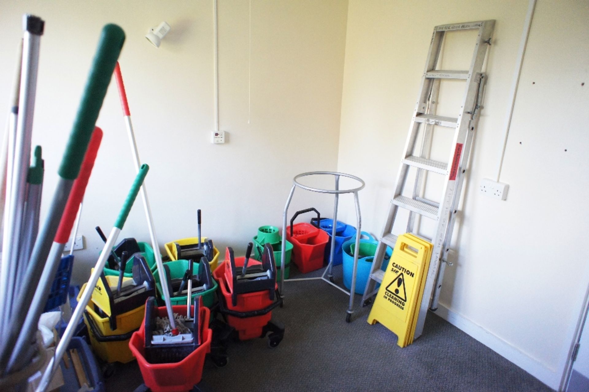 a quantity of miscellaneous cleaner’s equipment including; mobile buckets, and warning signs, mops