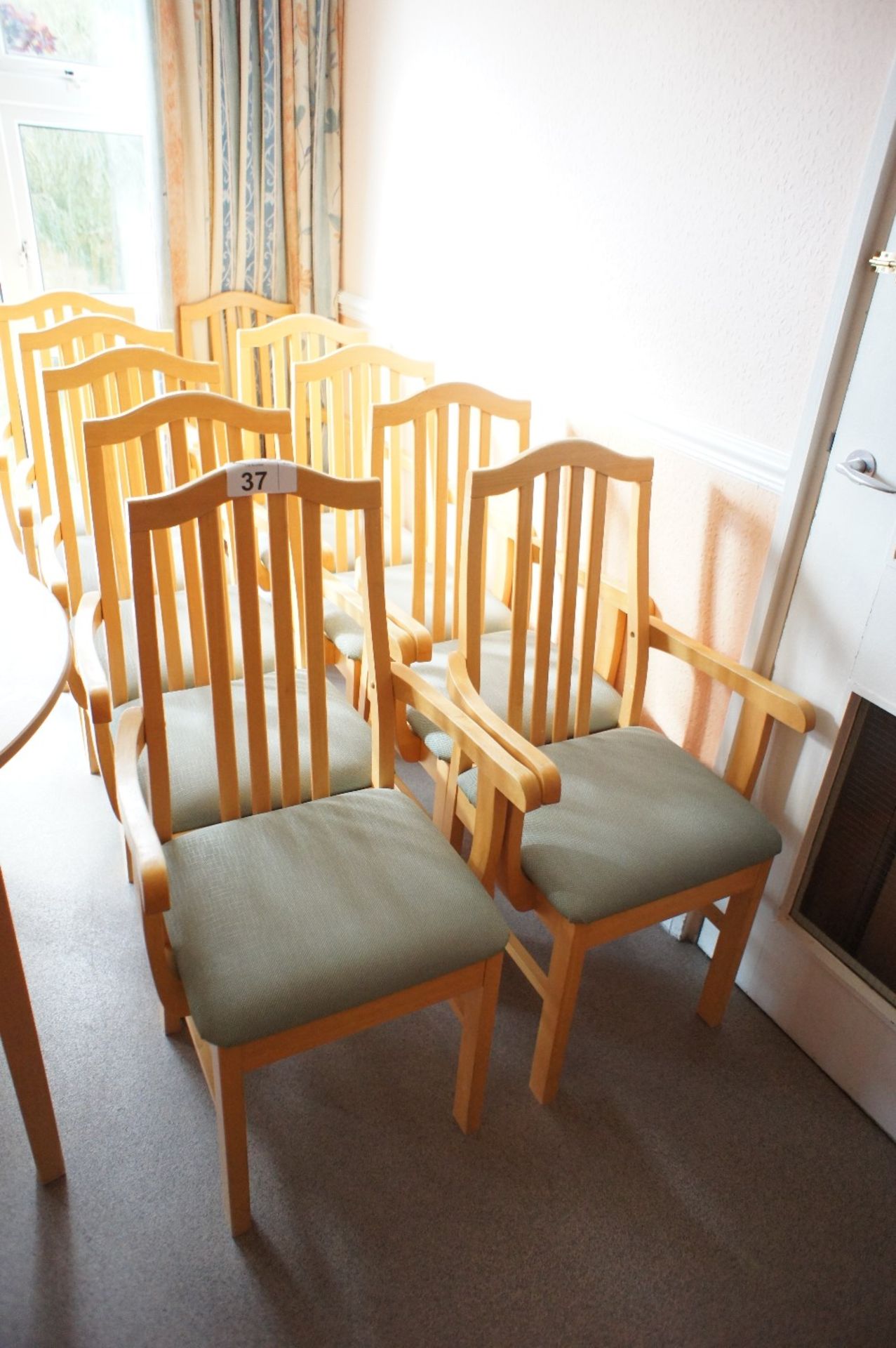 10 lightwood framed canteen armchairs with green easy clean upholstered seats (located in room 17,