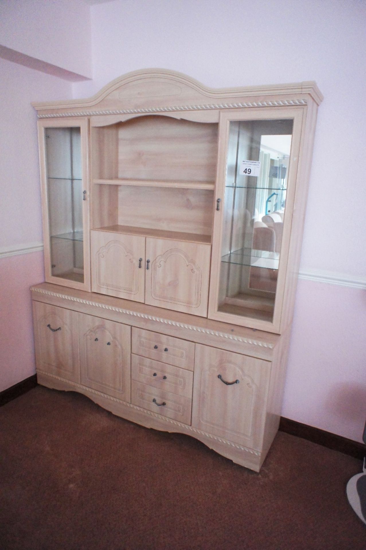 1 light colored woodgrained finished dresser with open shelves and cupboards (located in room 18,