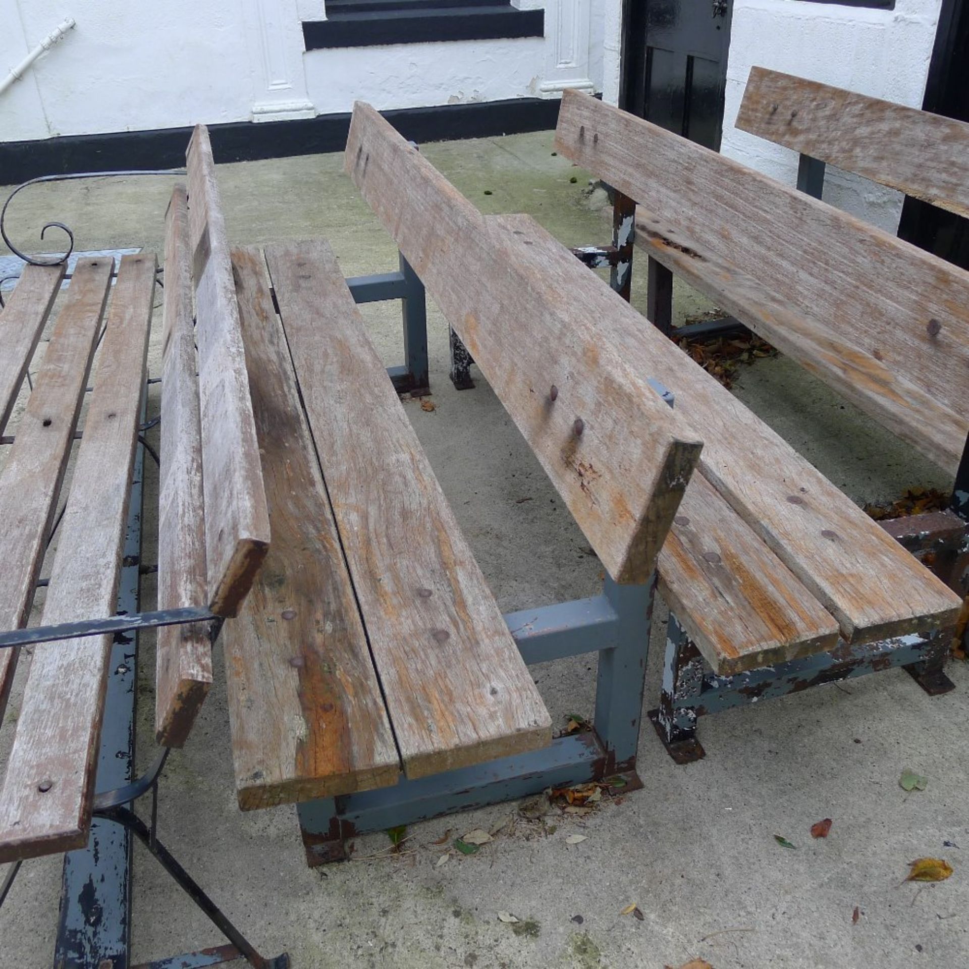 1 metal framed timber four seater garden bench (located in front courtyard)