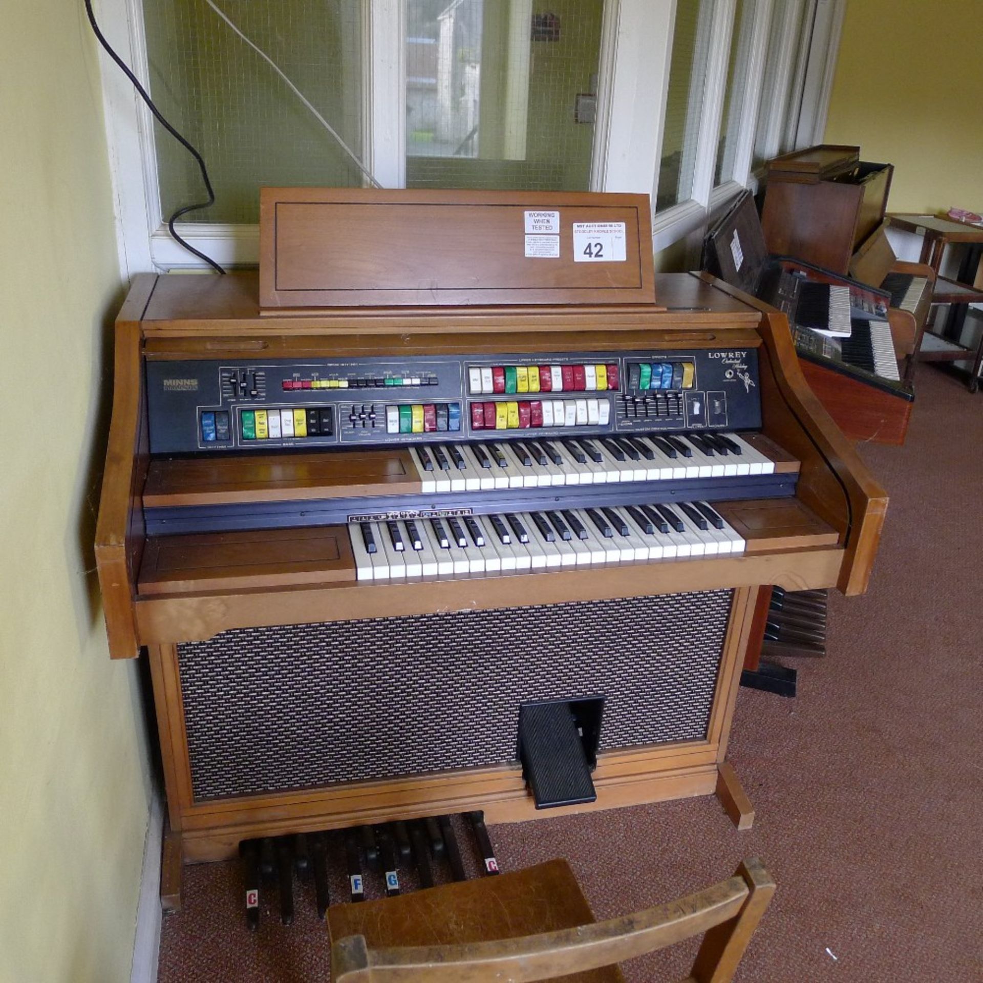 1 Lowrey Orchestral Holiday wooden cased electric double keyboard organ (located in nursery area)
