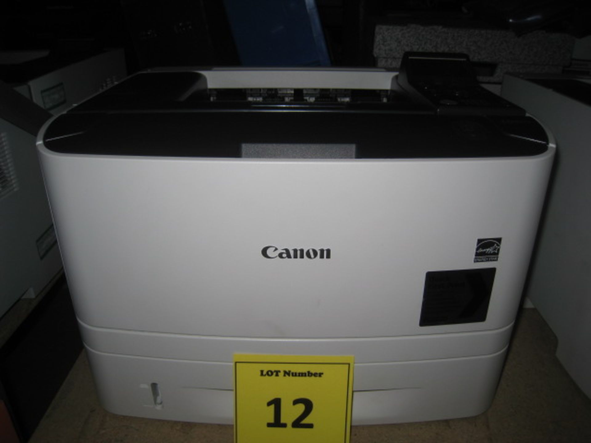 Canon i-Sense LBP6670DN Laser printer with test print. Page count = 2588