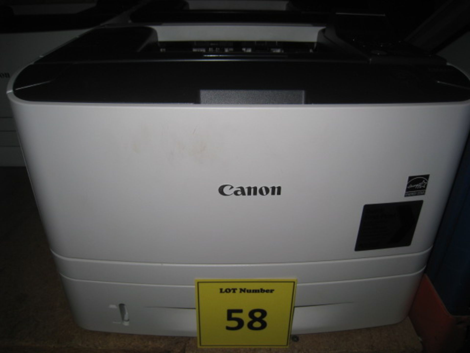 Canon i-Sense LBP6670DN laser printer with test print. Page count 6417