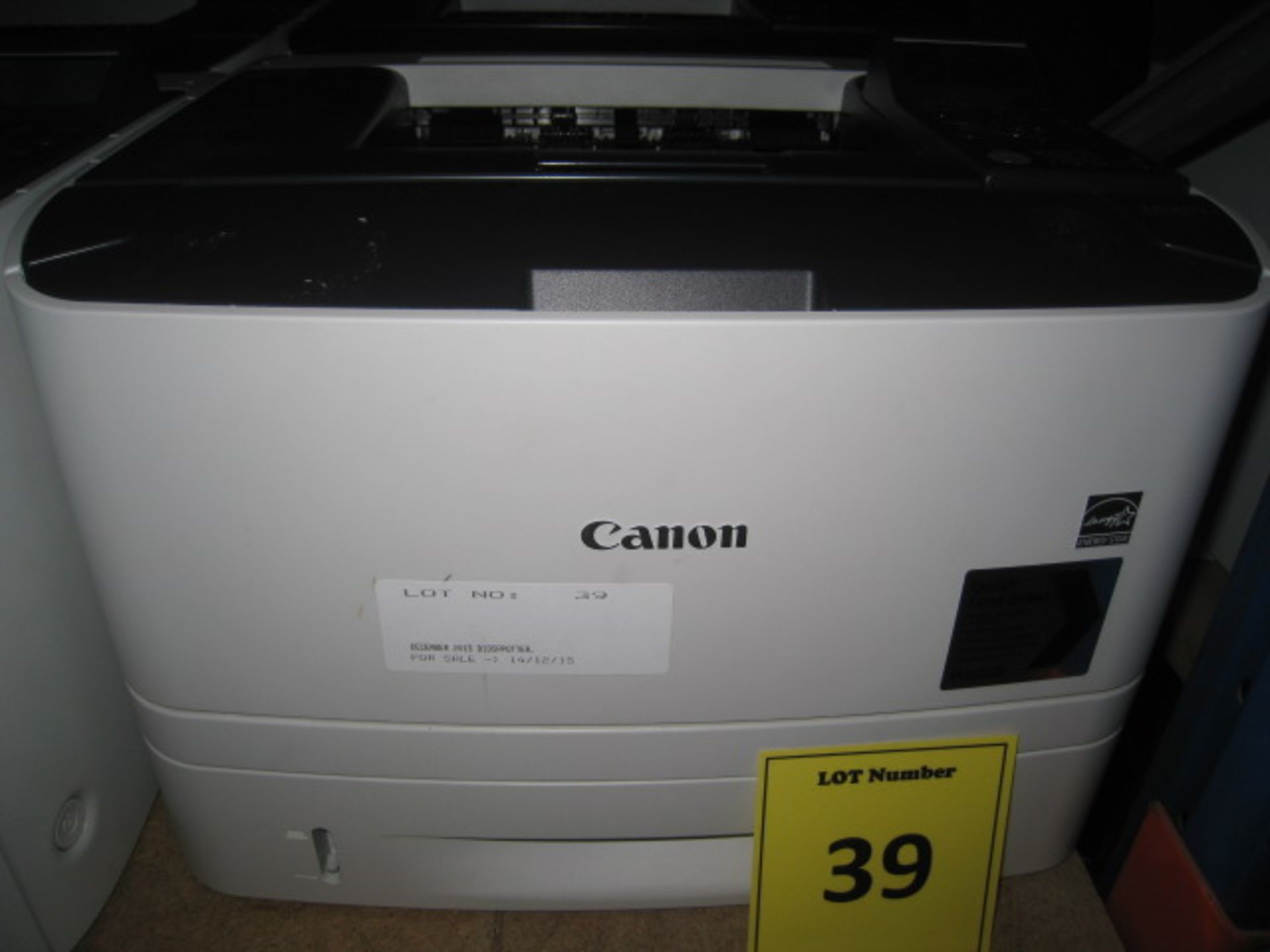 Canon i-Sense LBP 6670dn Laser printer with test print. Page count 9216