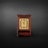 JAEGER LECOULTRE Travel clock sheathed in Havana crocodile skin leather. Signed gilt dial. Height: