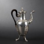 Ovoid plated-ware metal tripod coffeepot. Support terminating with lion claws and surmounted with