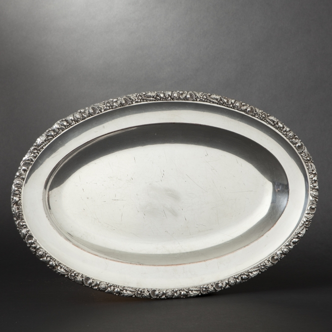 Oval plated-ware platter with frieze decoration of shells and algae along the border Master