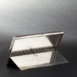 Rectangular silver cigarette case with gadrooned decoration. Interior with fourteen compartments and