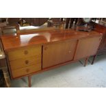 1970s teak sideboard with sliding doors.