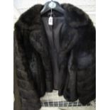 Ladies black fur type jacket.