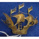 Silver gilt filigree ship brooch.