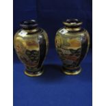 Pair of Japanese satsuma pottery dark bl