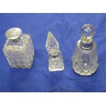 Three cut glass scent bottles with silve